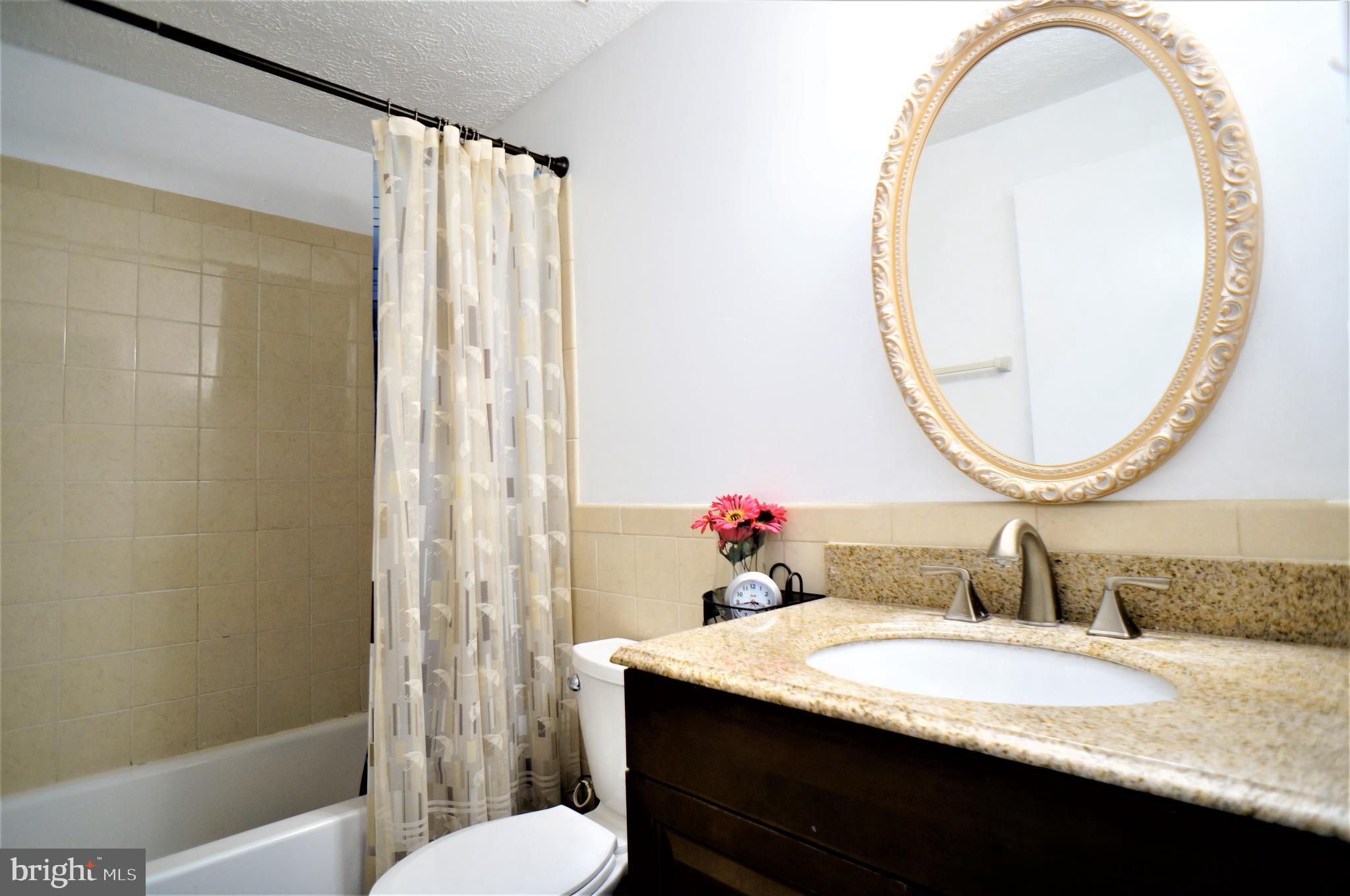 24228 Newbury Road Gaithersburg, MD 20882 - Photo 22 of 34 2nd floor hallway full bath w/ granite vanity