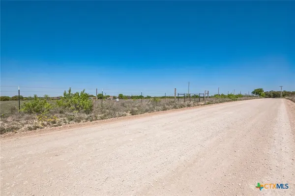 a view of a road with a yard
