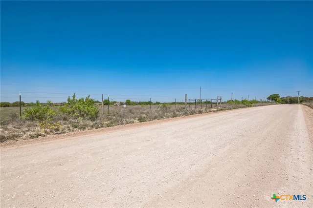 a view of a road with a yard