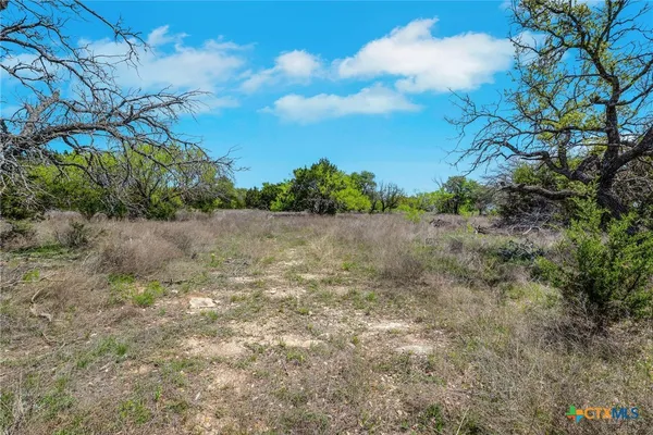 a view of a lake with a house in the background