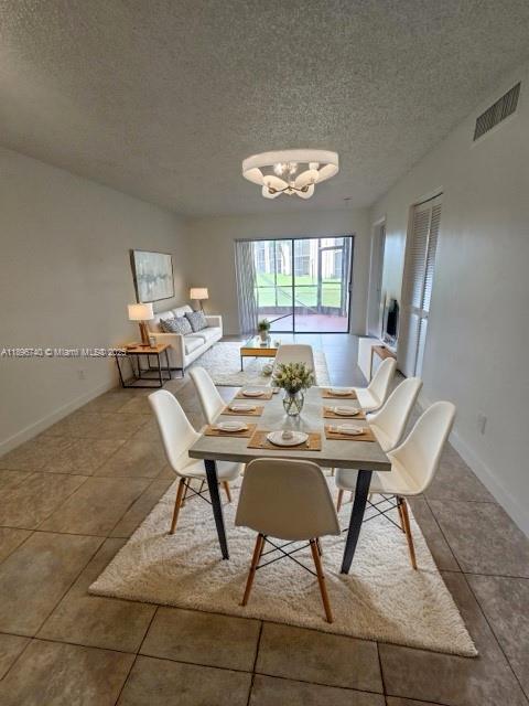 3396 Foxcroft Road, Unit 113 Miramar, FL 33025 - Photo 2 of 10 a view of a dining room with furniture