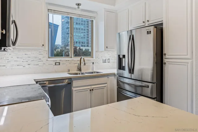 a bedroom with bed and a window