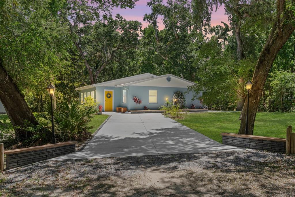 4645 South Ironwood Point Inverness, FL 34450 - Photo 1 of 1 a front view of a house with yard and green space