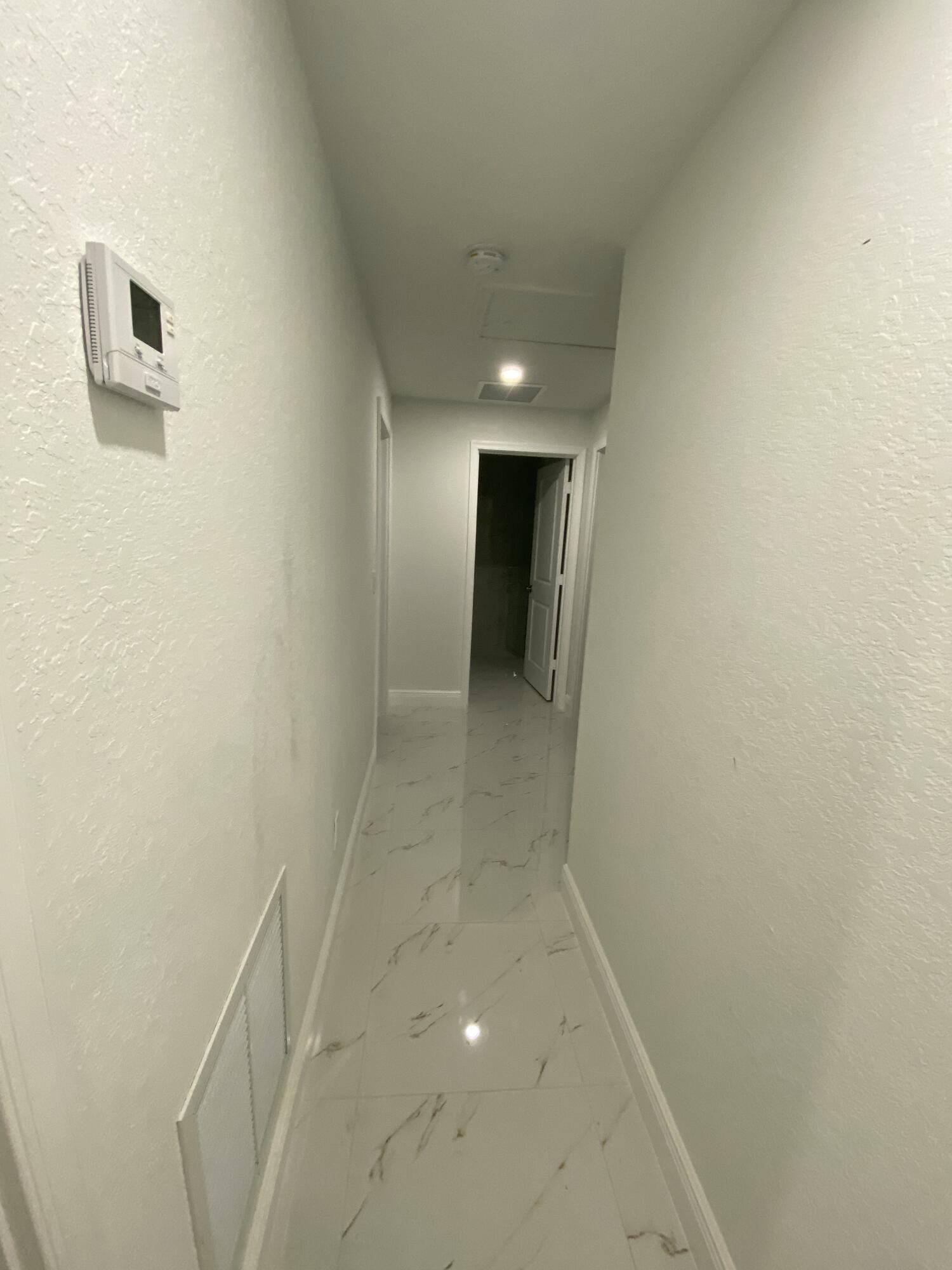 14597 Southwest 170th Avenue Indiantown, FL 34956 - Photo 16 of 31 a view of a hallway