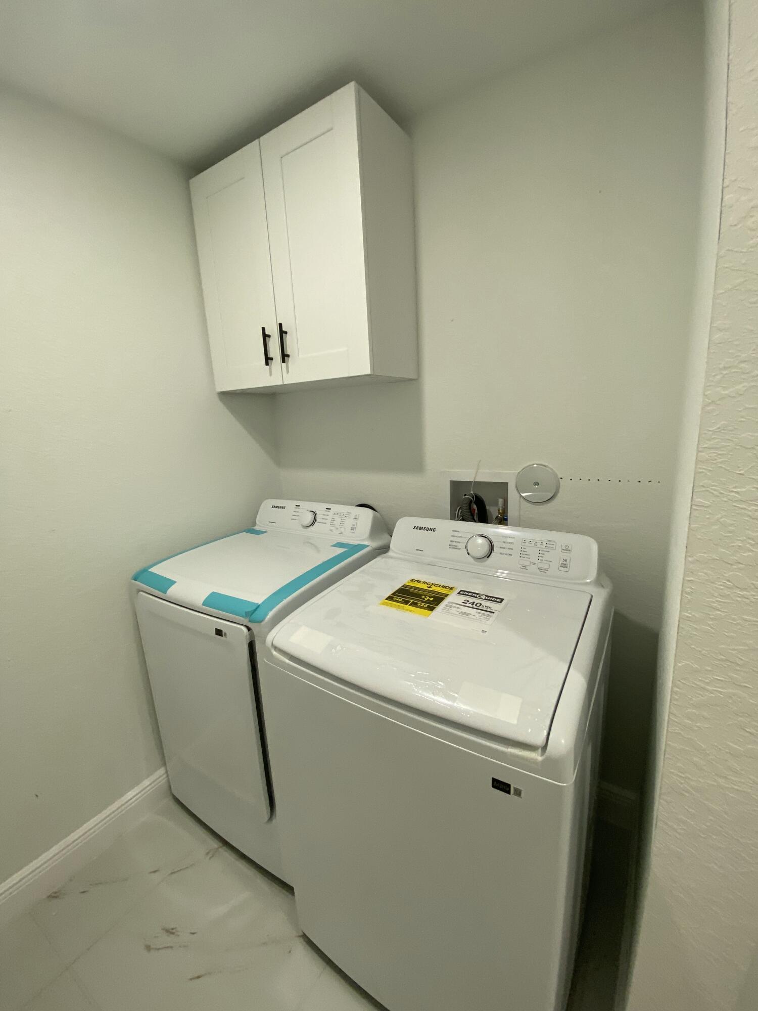 14597 Southwest 170th Avenue Indiantown, FL 34956 - Photo 18 of 31 a utility room with dryer and washer
