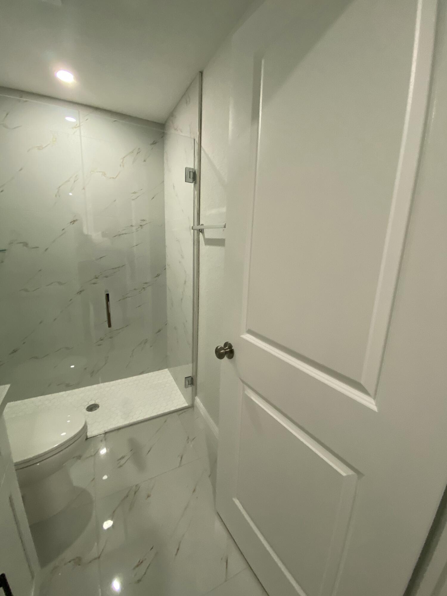 14597 Southwest 170th Avenue Indiantown, FL 34956 - Photo 19 of 31 a bathroom with a shower