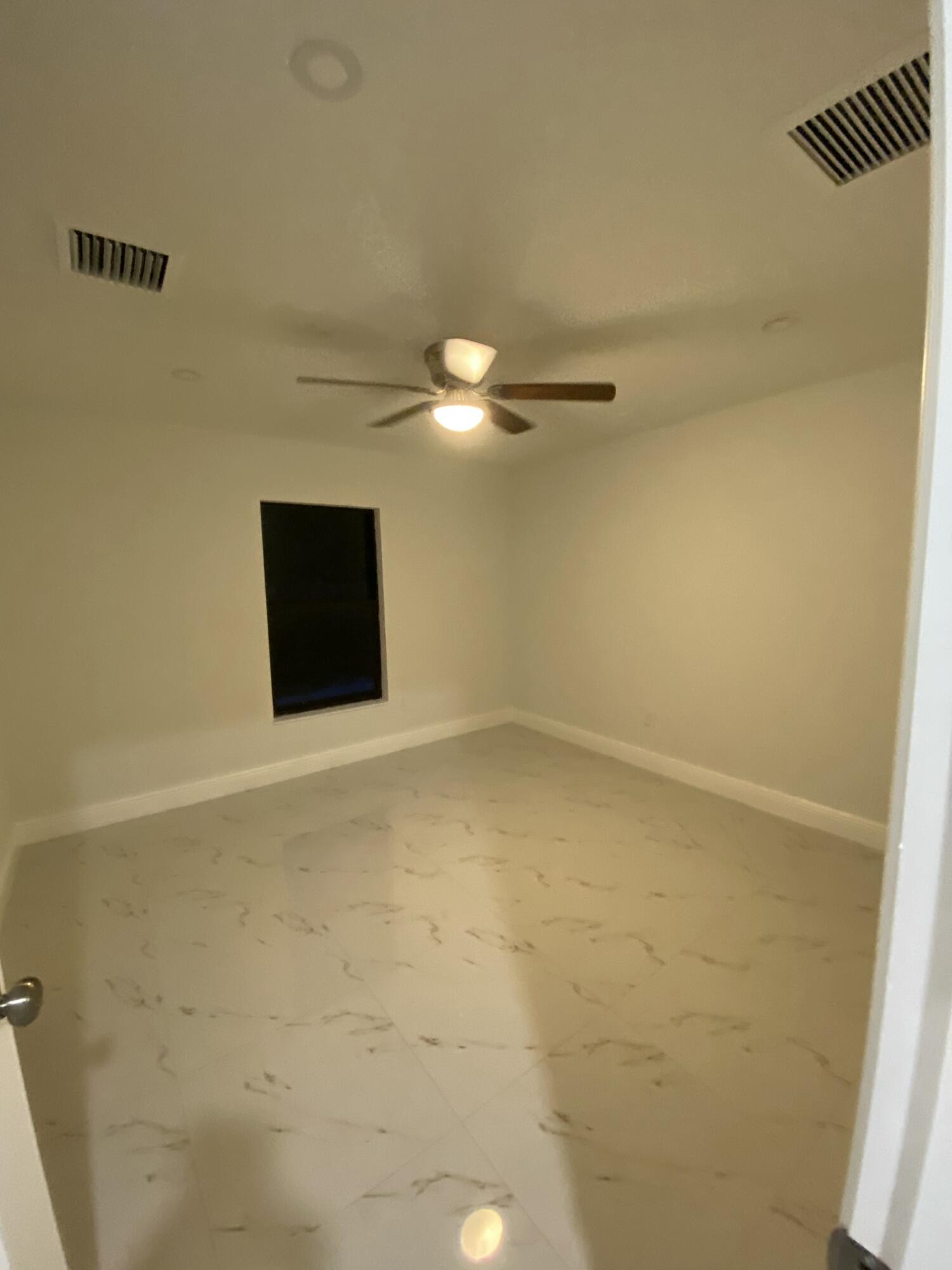 14597 Southwest 170th Avenue Indiantown, FL 34956 - Photo 20 of 31 a view of a room with a projector