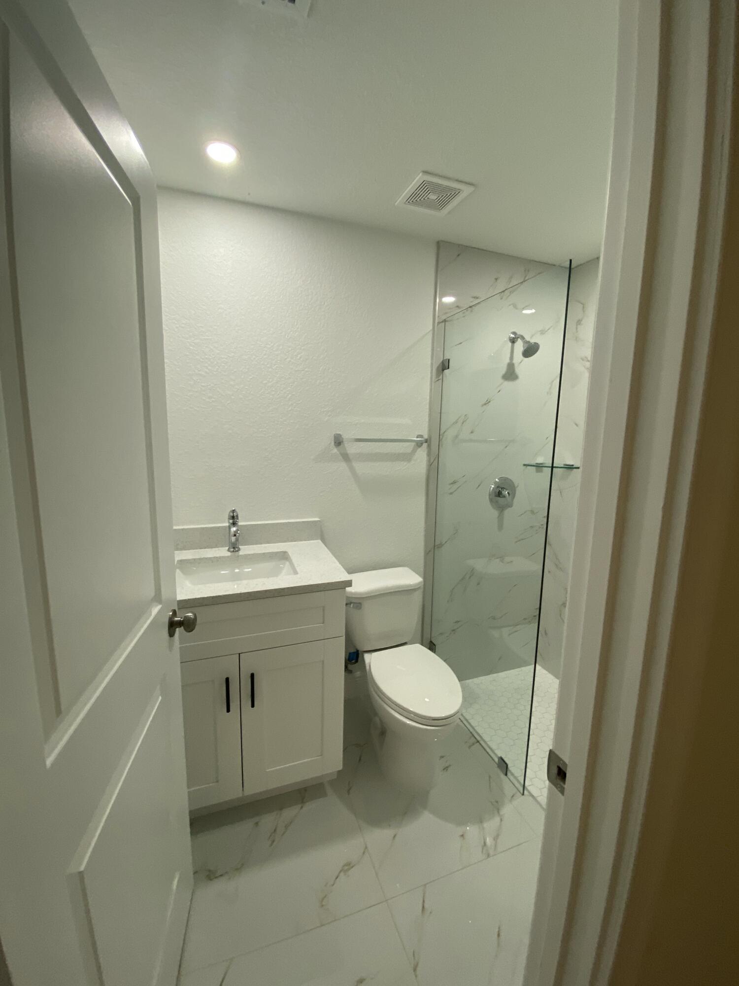 14597 Southwest 170th Avenue Indiantown, FL 34956 - Photo 21 of 31 a bathroom with a sink toilet and shower