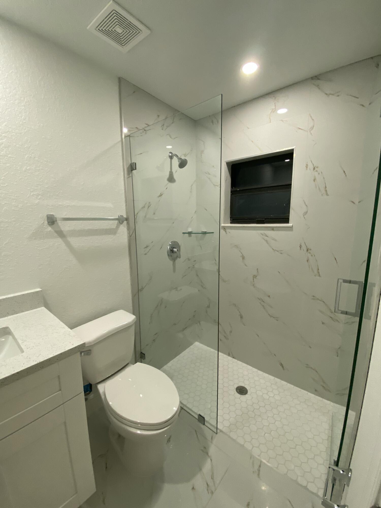 14597 Southwest 170th Avenue Indiantown, FL 34956 - Photo 22 of 31 a bathroom with a toilet a sink and shower