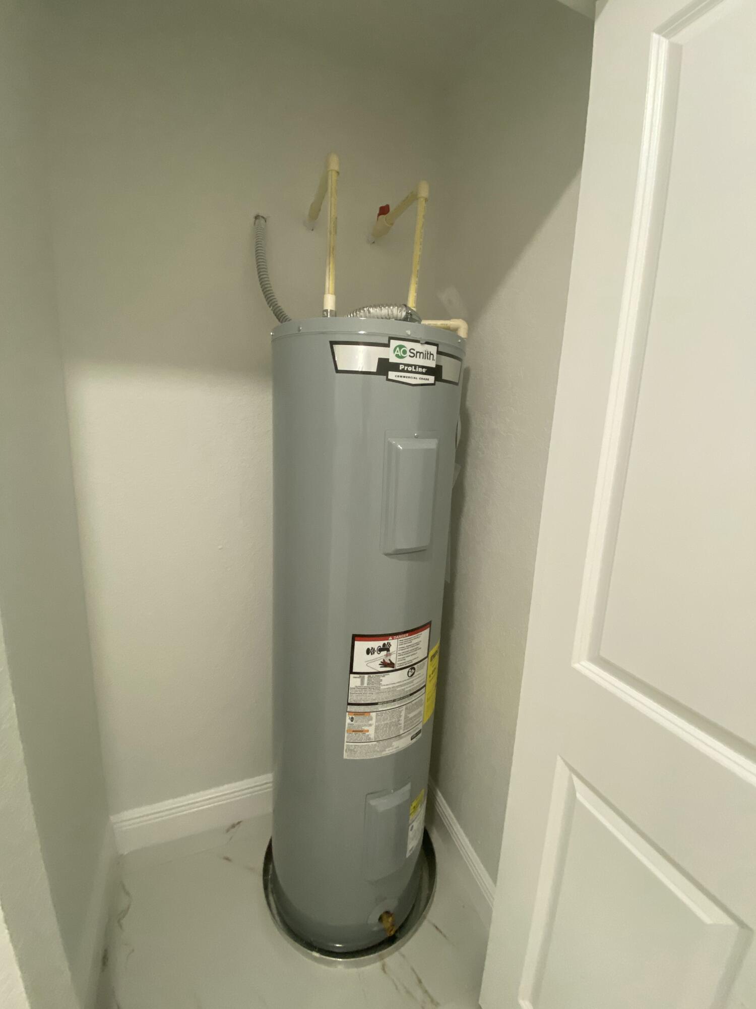 14597 Southwest 170th Avenue Indiantown, FL 34956 - Photo 29 of 31 a view of water heater room