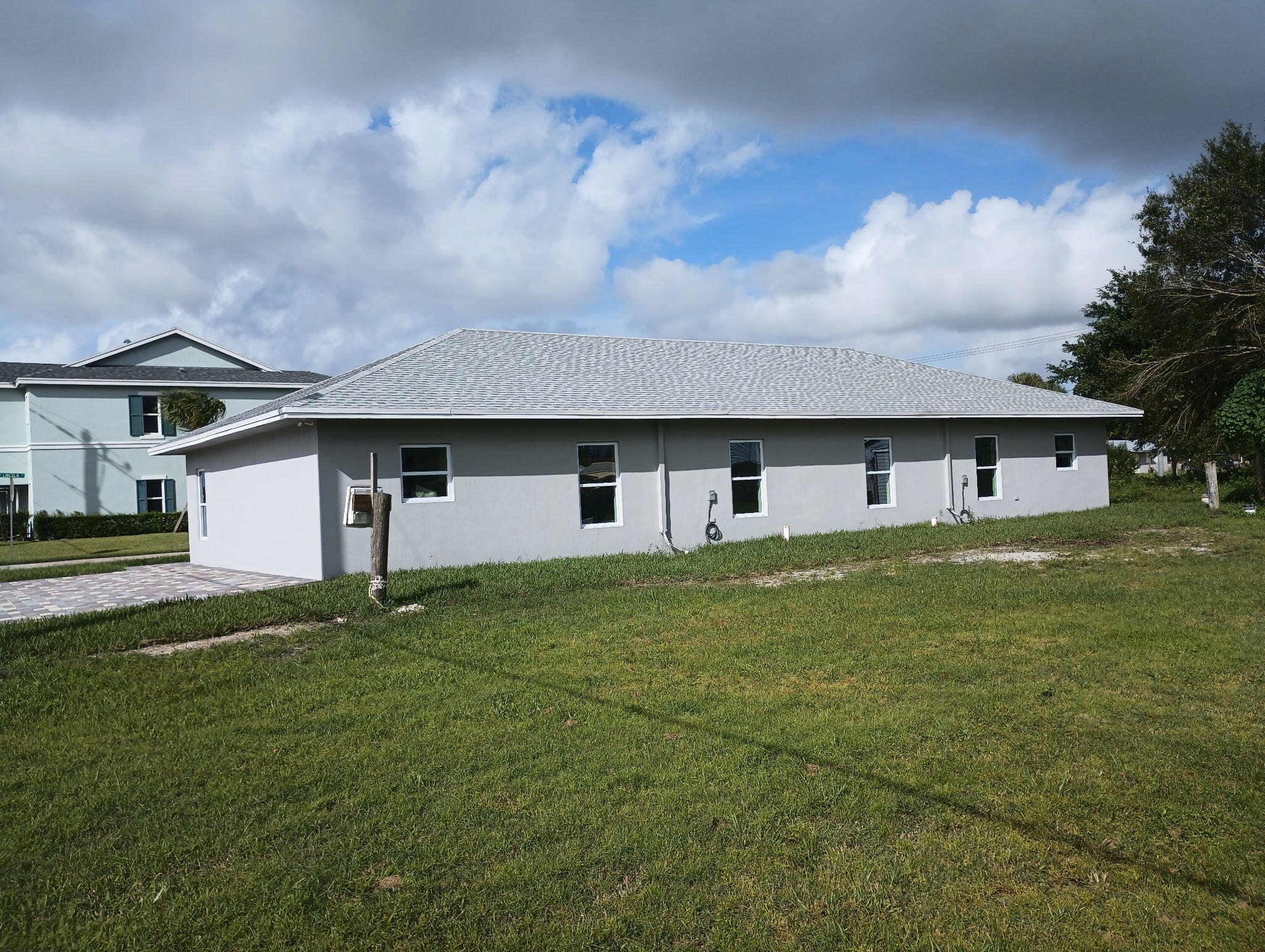 14597 Southwest 170th Avenue Indiantown, FL 34956 - Photo 3 of 31 a house view with a garden space