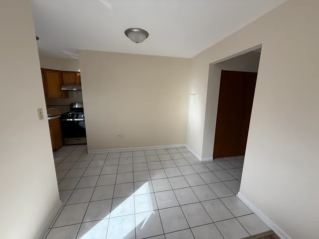 a view of an empty room with a stove