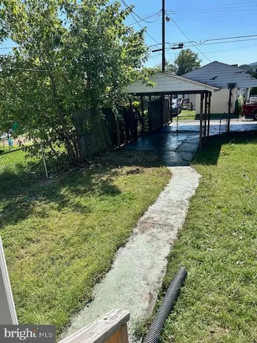 a view of swimming pool from a yard