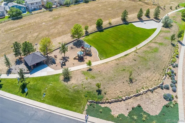 a view of a garden with a house