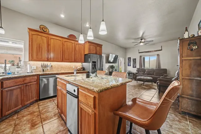 a living room with fireplace furniture and a chandelier