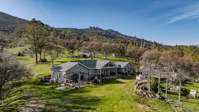 a aerial view of a house with a big yard