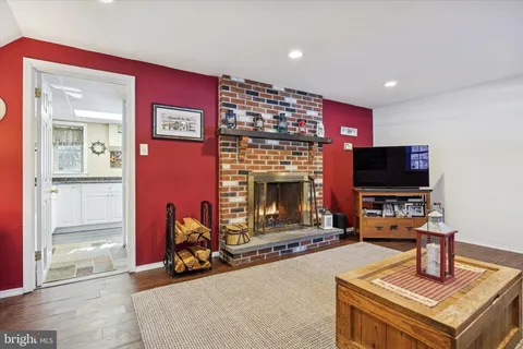 a view of a dining room with furniture and a window