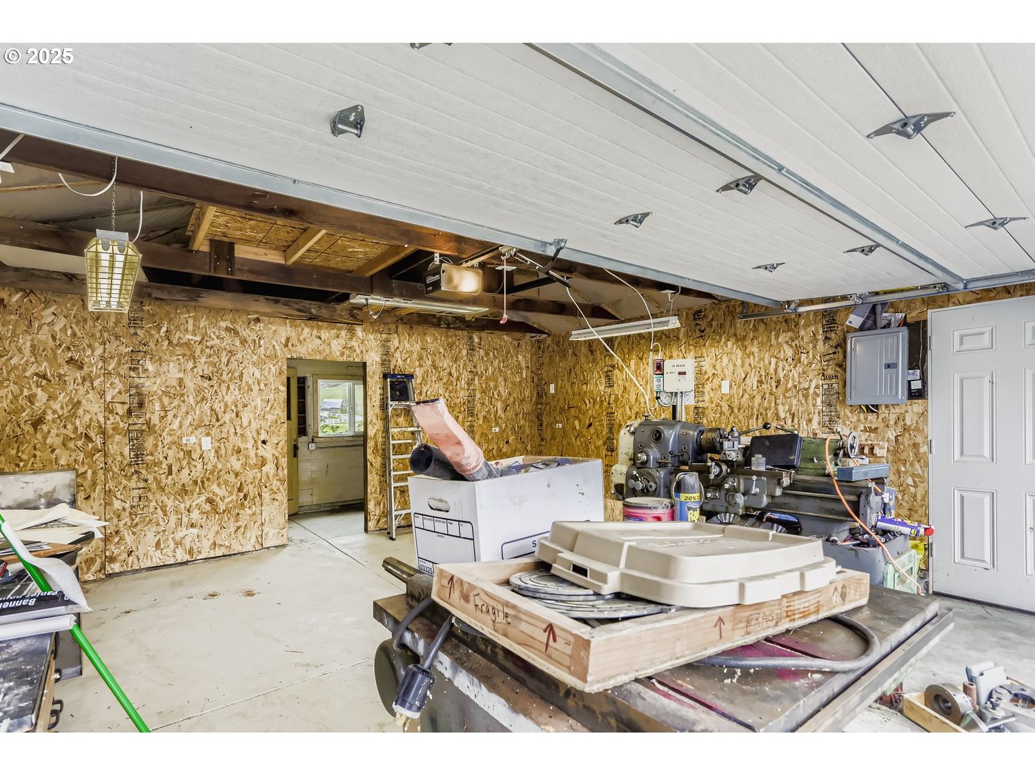15996 South Thayer Road Oregon City, OR 97045 - Photo 19 of 25 a living room with furniture and a flat screen tv