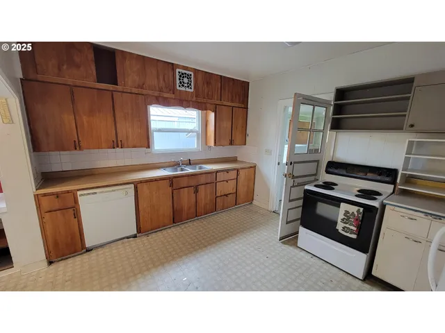 a kitchen with appliances and cabinets