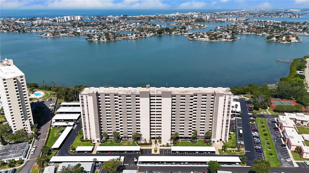 an aerial view of residential building and lake