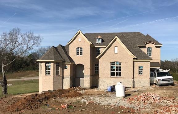 5000 Weatherford Pass, Unit 102 Franklin, TN 37064 - Photo 2 of 29 a front view of a house with a yard
