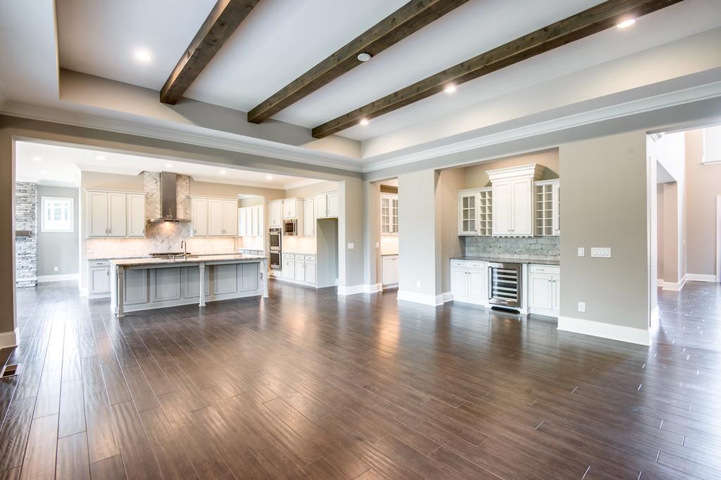 5000 Weatherford Pass, Unit 102 Franklin, TN 37064 - Photo 16 of 29 a view of an entryway with wooden floors and kitchen view