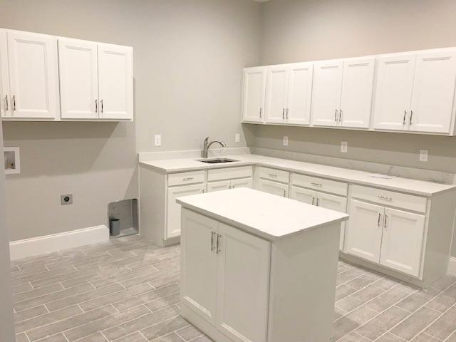 5000 Weatherford Pass, Unit 102 Franklin, TN 37064 - Photo 27 of 29 a kitchen with white cabinets appliances and a sink