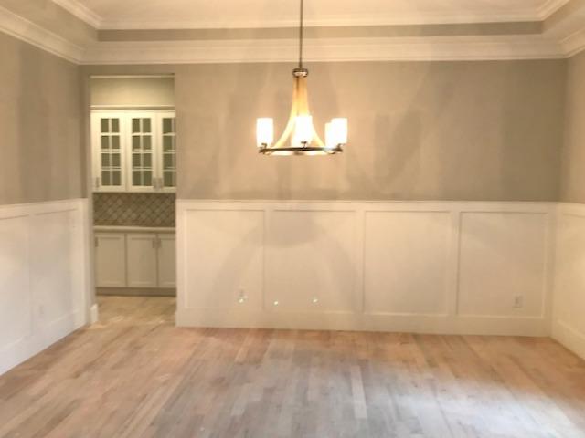 5000 Weatherford Pass, Unit 102 Franklin, TN 37064 - Photo 6 of 29 an empty room with windows and cabinet