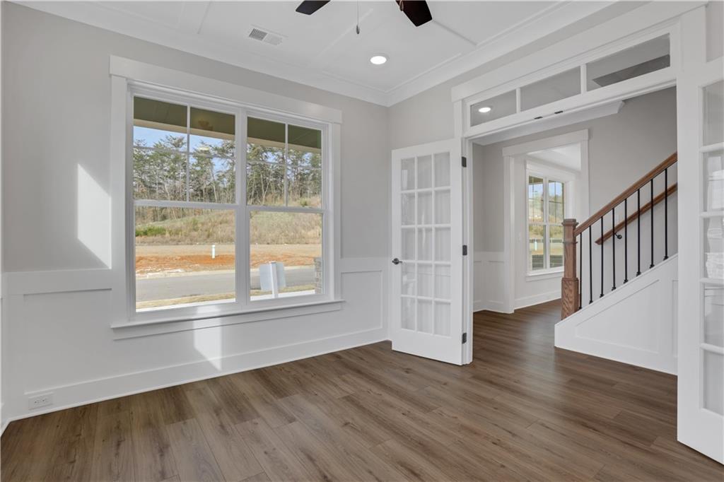 138 Marble Tree Way Ball Ground, GA 30107 - Photo 12 of 65 a view of an entryway with wooden floor and windows