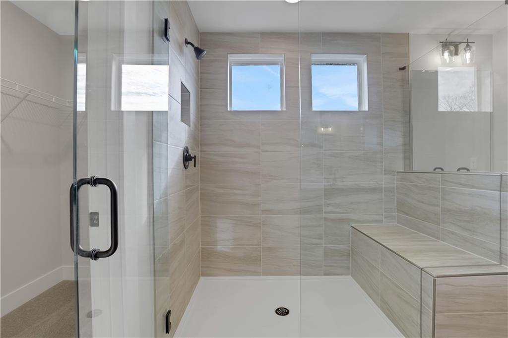 138 Marble Tree Way Ball Ground, GA 30107 - Photo 37 of 65 a bathroom with a shower