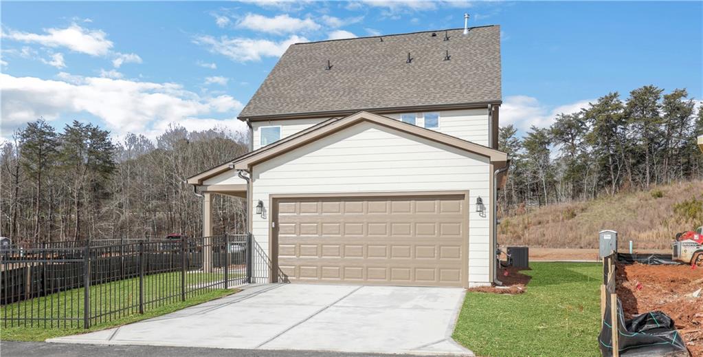 138 Marble Tree Way Ball Ground, GA 30107 - Photo 50 of 65 a front view of a house with garden
