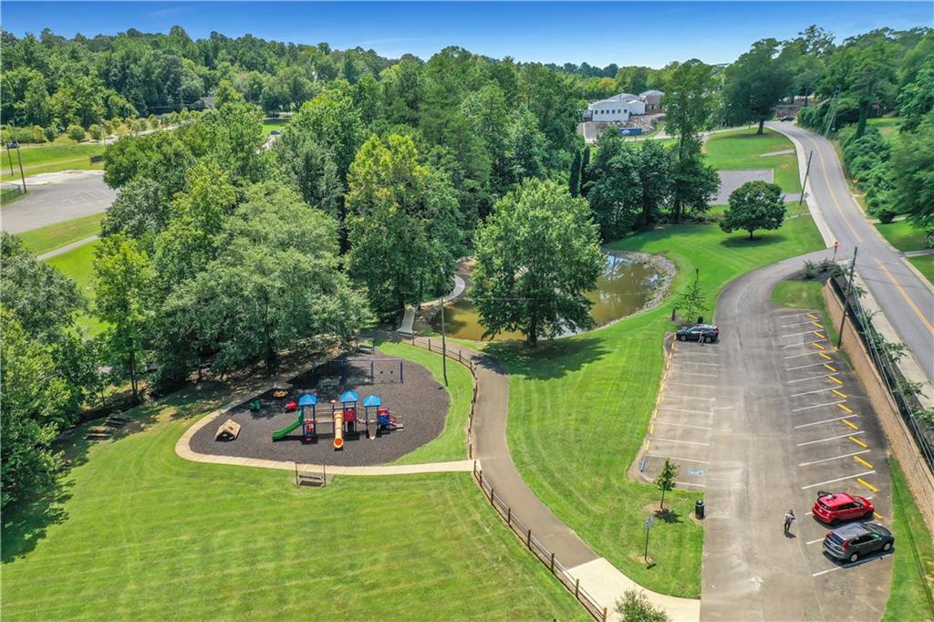138 Marble Tree Way Ball Ground, GA 30107 - Photo 61 of 65 an aerial view of a house with a swimming pool