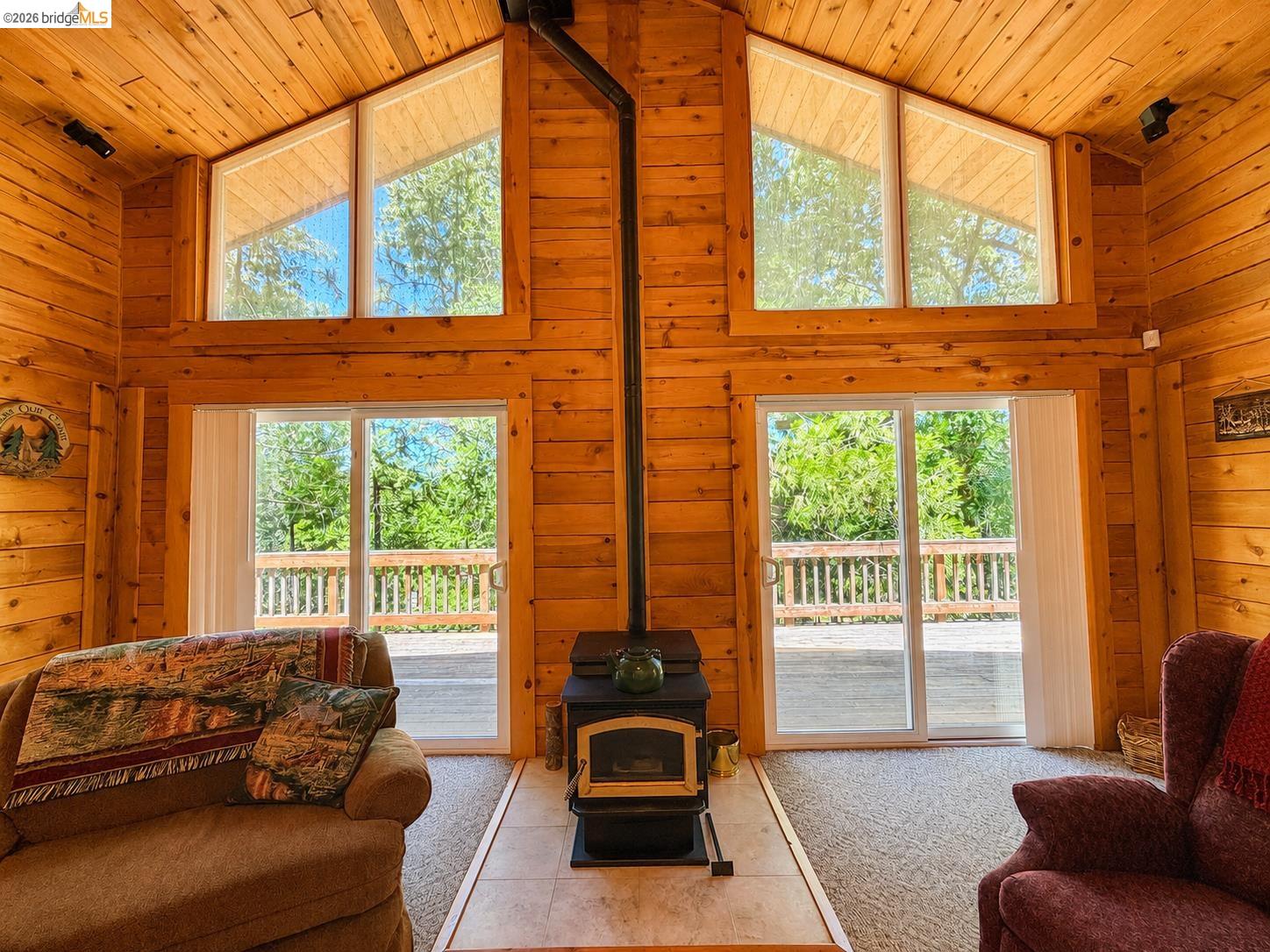 21181 Phoenix Lake Road Sonora, CA 95370 - Photo 7 of 34 Vaulted wood-paneled ceilings with exposed beams