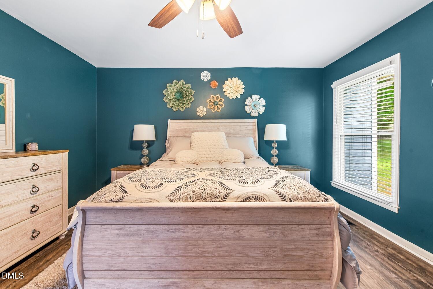 134 Longview Road Madison, NC 27025 - Photo 27 of 49 a bed sitting in a bedroom next to a window