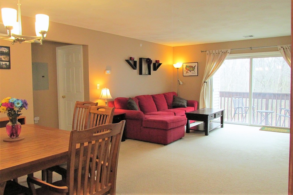 330 Sunderland Road, Unit 95 Worcester, MA 01604 - Photo 2 of 24 a living room with furniture and a large window