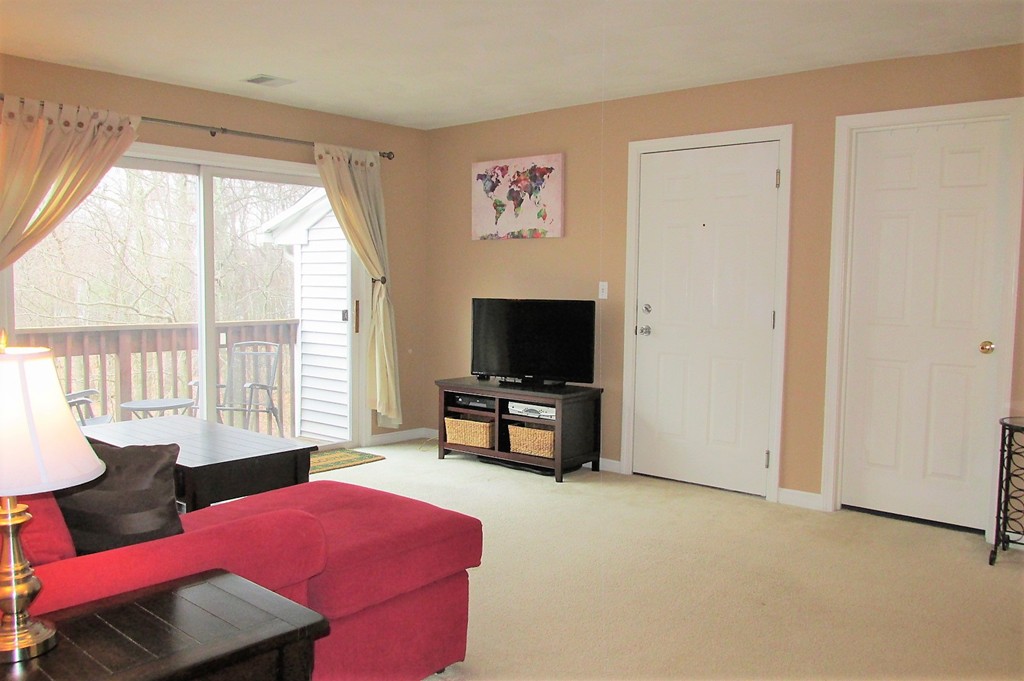 330 Sunderland Road, Unit 95 Worcester, MA 01604 - Photo 3 of 24 a living room with furniture and a flat screen tv