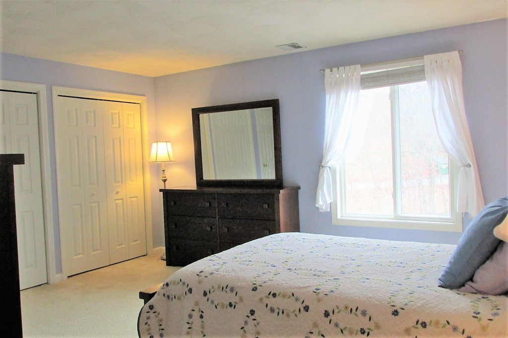 330 Sunderland Road, Unit 95 Worcester, MA 01604 - Photo 9 of 24 a bedroom with a bed and a window