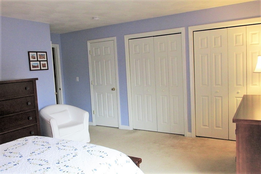 330 Sunderland Road, Unit 95 Worcester, MA 01604 - Photo 10 of 24 a bathroom with a sink a toilet and shower curtain
