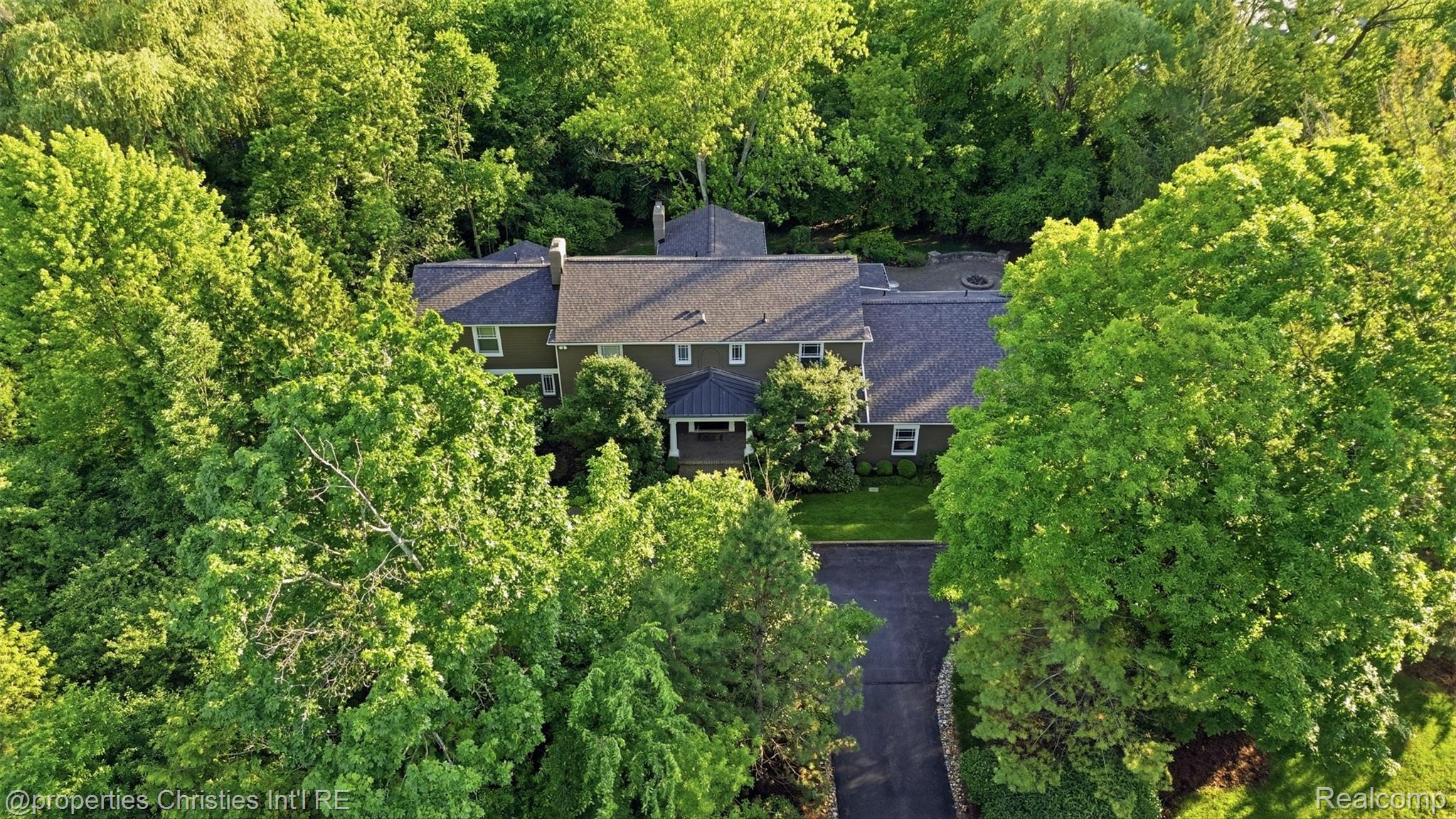 25235 Canterbury Road Franklin, MI 48025 - Photo 51 of 56 Sprawling residence featuring a dark-toned siding facade and a multi-pitch roofline