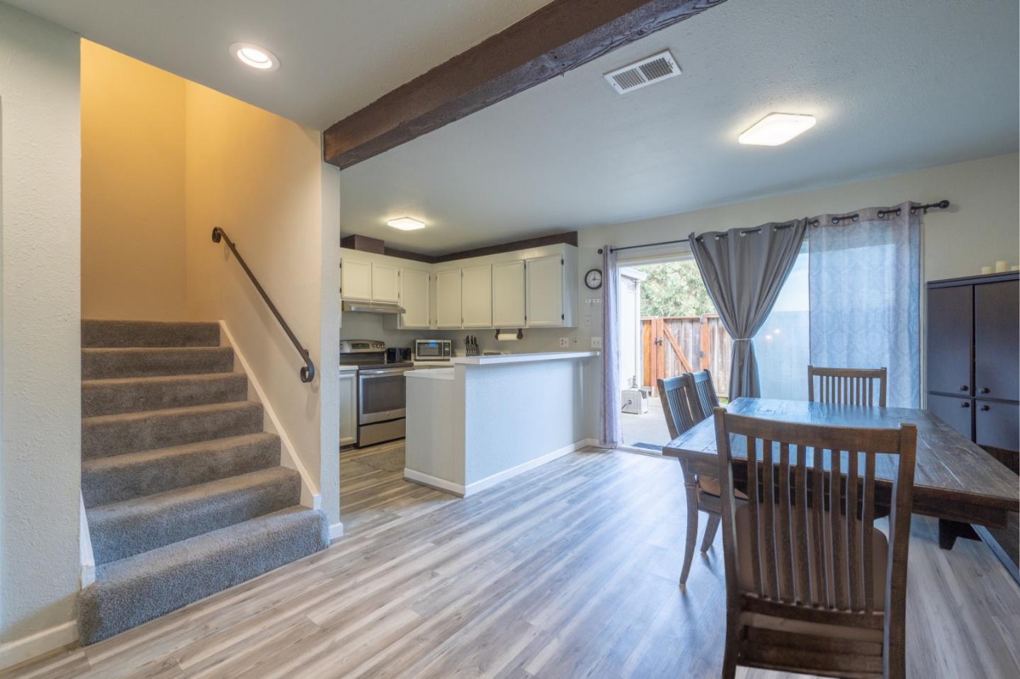 1267 Rosita Road Pacifica, CA 94044 - Photo 11 of 24 a view of a kitchen with wooden floor and electronic appliances