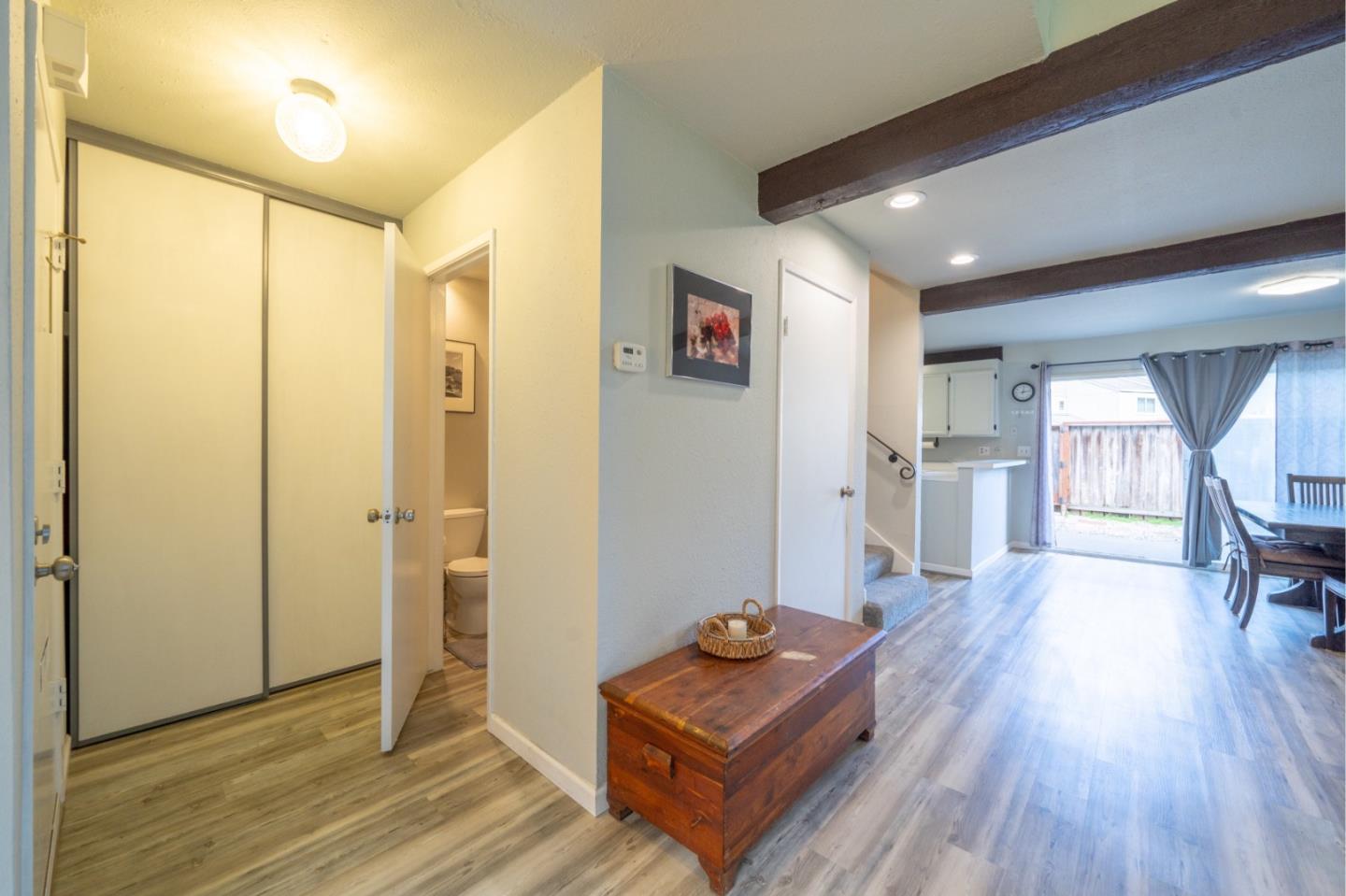 1267 Rosita Road Pacifica, CA 94044 - Photo 13 of 24 a living room with furniture and a wooden floor