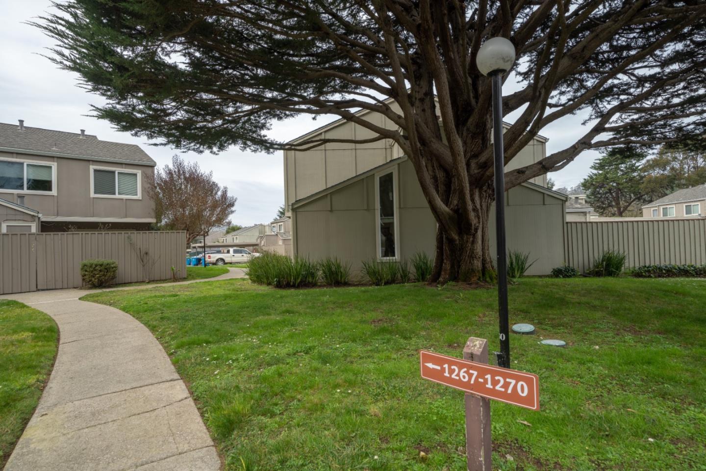 1267 Rosita Road Pacifica, CA 94044 - Photo 2 of 24 a street sign on the side of the house