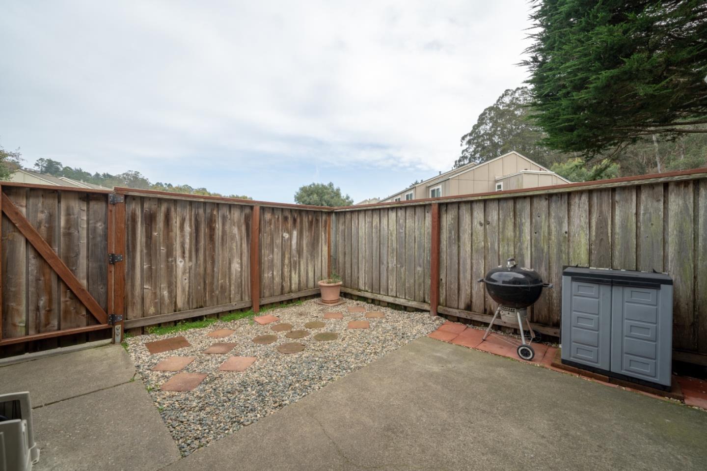 1267 Rosita Road Pacifica, CA 94044 - Photo 21 of 24 a view of a backyard with furniture