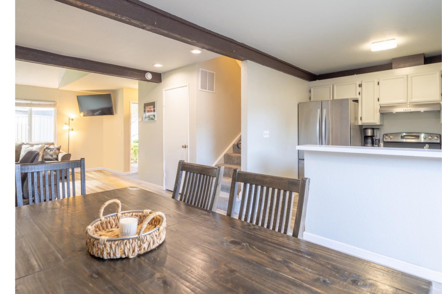 1267 Rosita Road Pacifica, CA 94044 - Photo 7 of 24 a living room with kitchen island furniture and a wooden floor