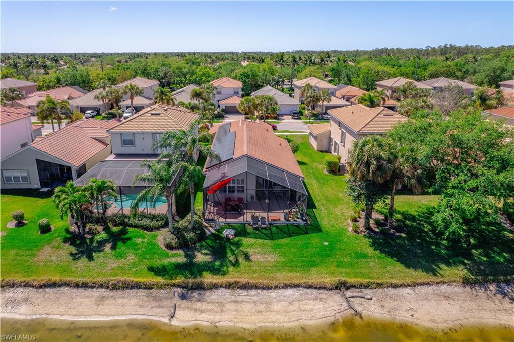 1638 Triangle Palm Terrace Naples, FL 34119 - Photo 1 of 21 Aerial view of residential area