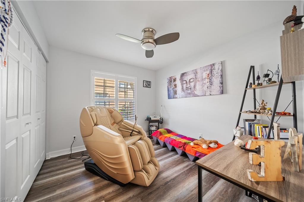 1638 Triangle Palm Terrace Naples, FL 34119 - Photo 11 of 21 Office with dark wood-style floors and a ceiling fan