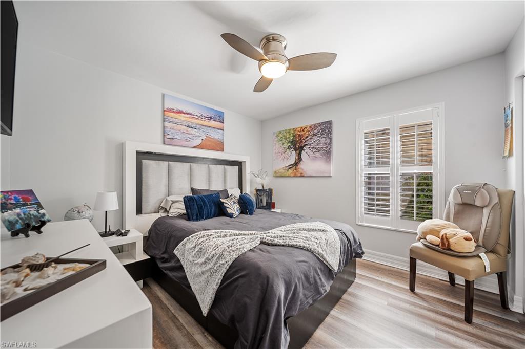 1638 Triangle Palm Terrace Naples, FL 34119 - Photo 13 of 21 Bedroom with wood finished floors and ceiling fan