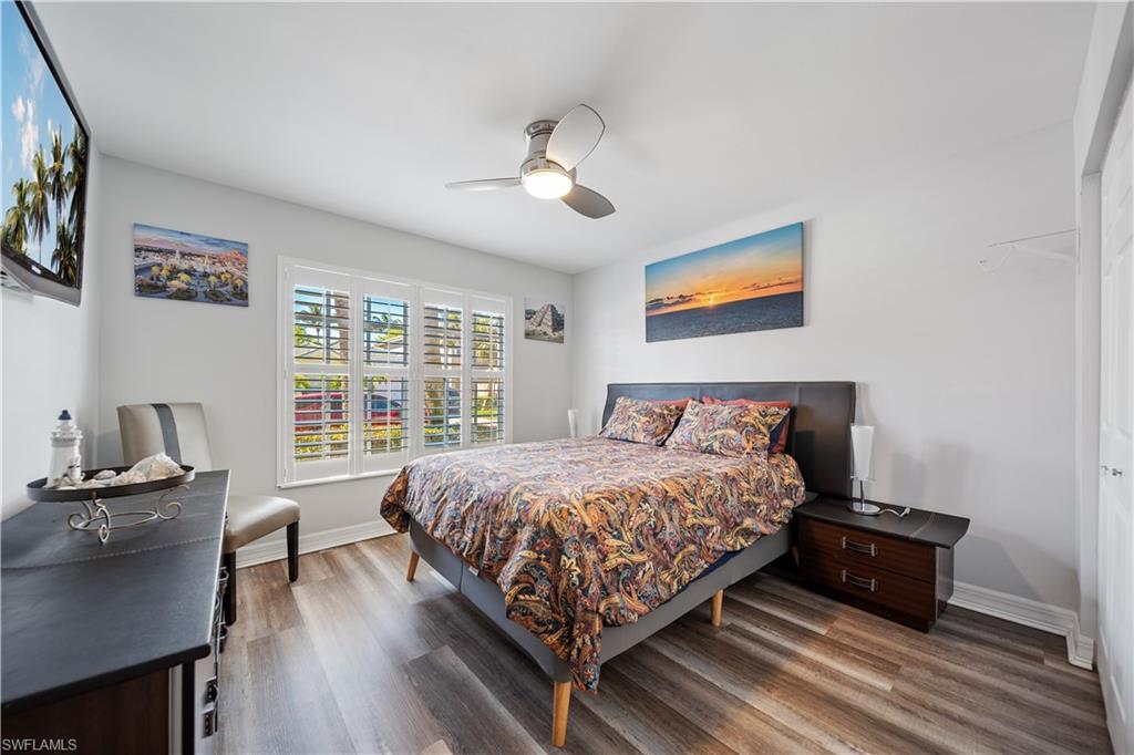 1638 Triangle Palm Terrace Naples, FL 34119 - Photo 18 of 21 Bedroom with wood finished floors and ceiling fan