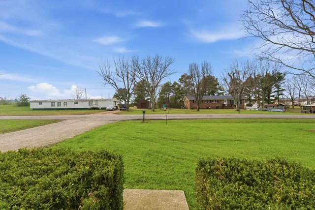 a view of a golf course with a lake