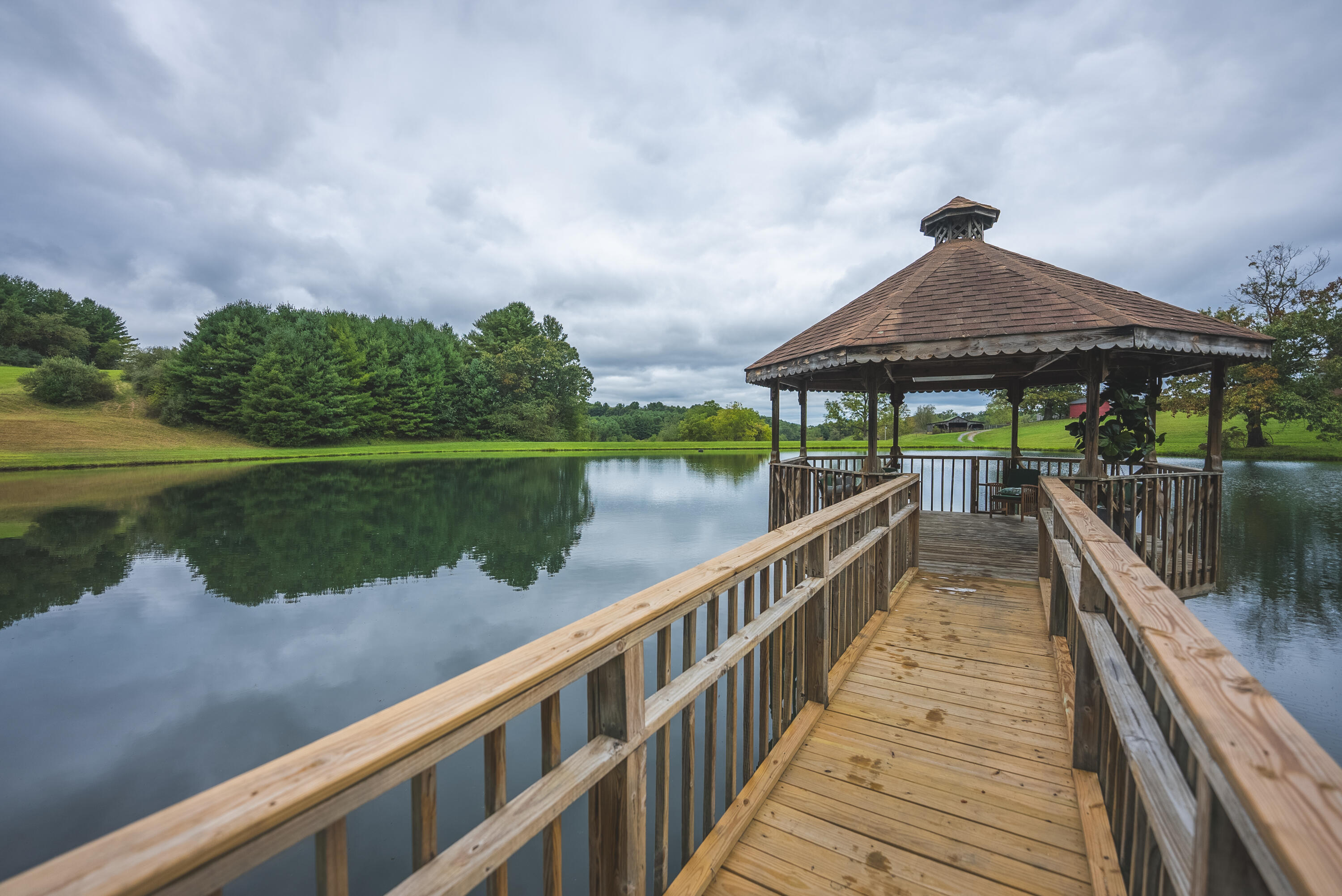 2066 Webbs Mill Road North Floyd, VA 24091 - Photo 5 of 63 a view of a lake with a deck